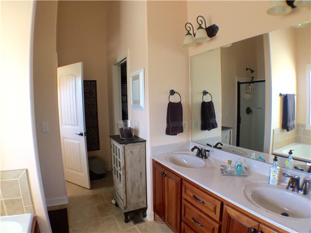 525 Sugar Flat Road Lebanon, TN 37087 - Photo 18 of 20 a bathroom with double vanity and a mirror