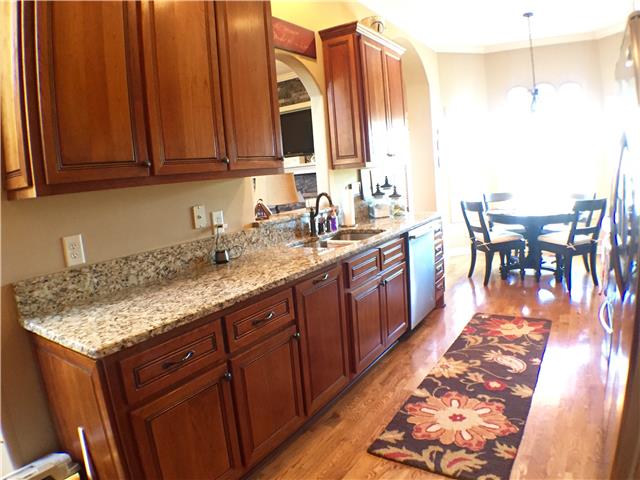 525 Sugar Flat Road Lebanon, TN 37087 - Photo 7 of 20 a kitchen with stainless steel appliances granite countertop a sink stove and cabinets