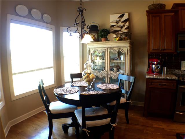 525 Sugar Flat Road Lebanon, TN 37087 - Photo 8 of 20 a view of a dining room with furniture window and wooden floor