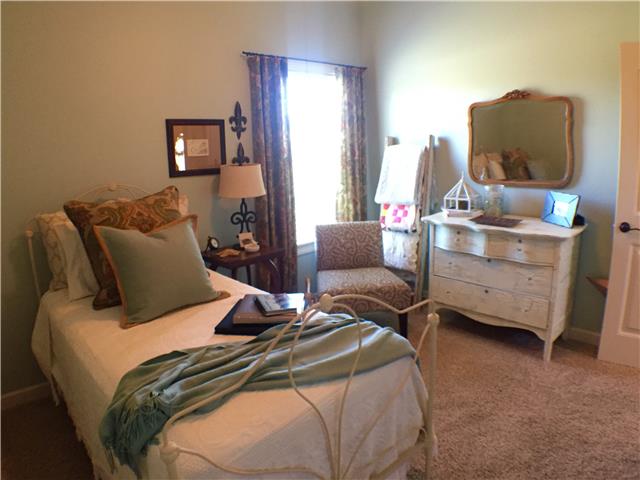 525 Sugar Flat Road Lebanon, TN 37087 - Photo 10 of 20 a bed room with a bed and a chair