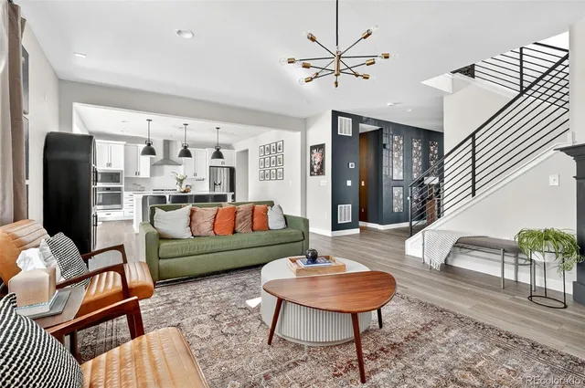 a living room with furniture and a rug