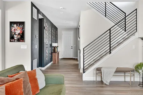 a kitchen with stainless steel appliances granite countertop a kitchen island a stove a table and chairs