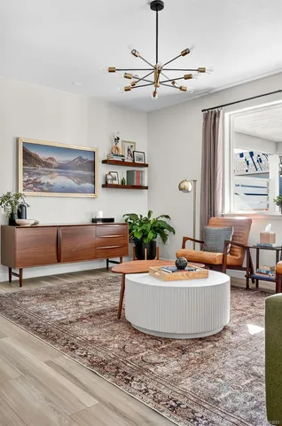 a kitchen with a dining table chairs and white cabinets