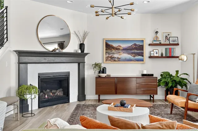 a kitchen with stainless steel appliances granite countertop a kitchen island a stove a table and chairs