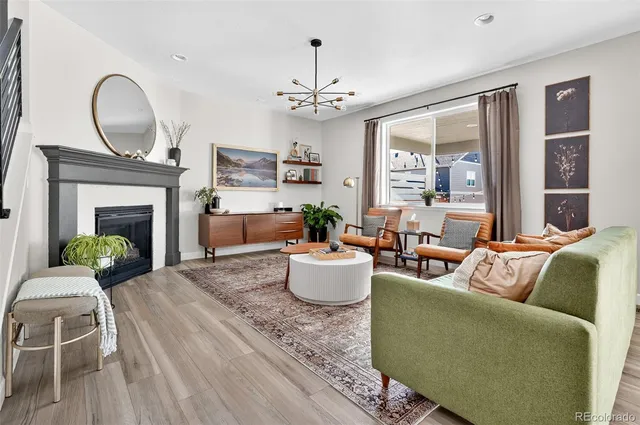 a kitchen with stainless steel appliances granite countertop a sink a stove and a white cabinets