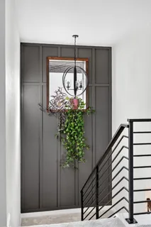 a front view of a house with patio and garden