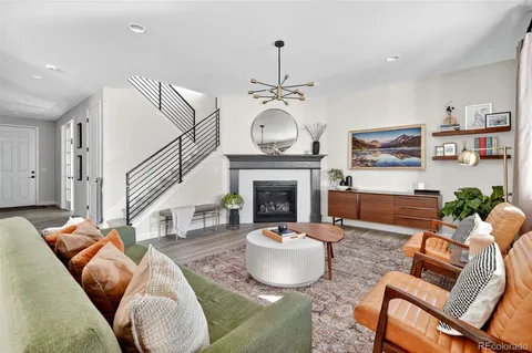 a living room with furniture and a rug