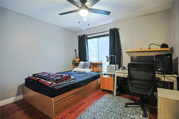 a bed room with a bed and a television