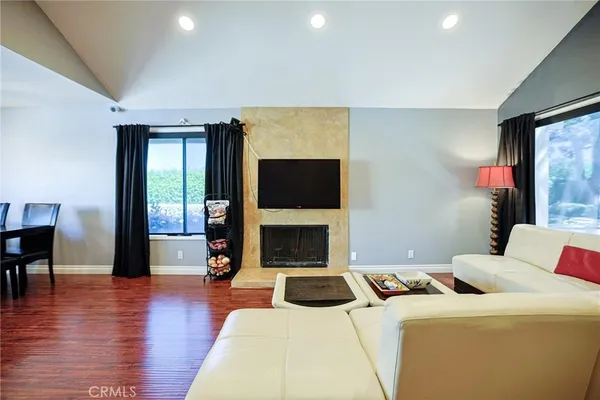 a bedroom with a bed and a fireplace