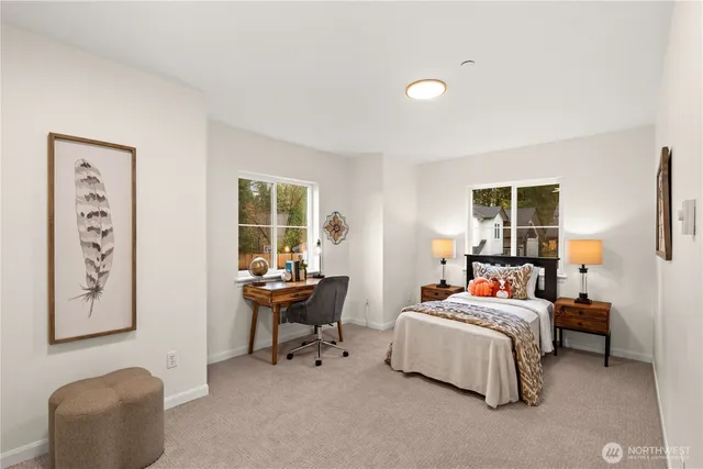 a bedroom with furniture and a window