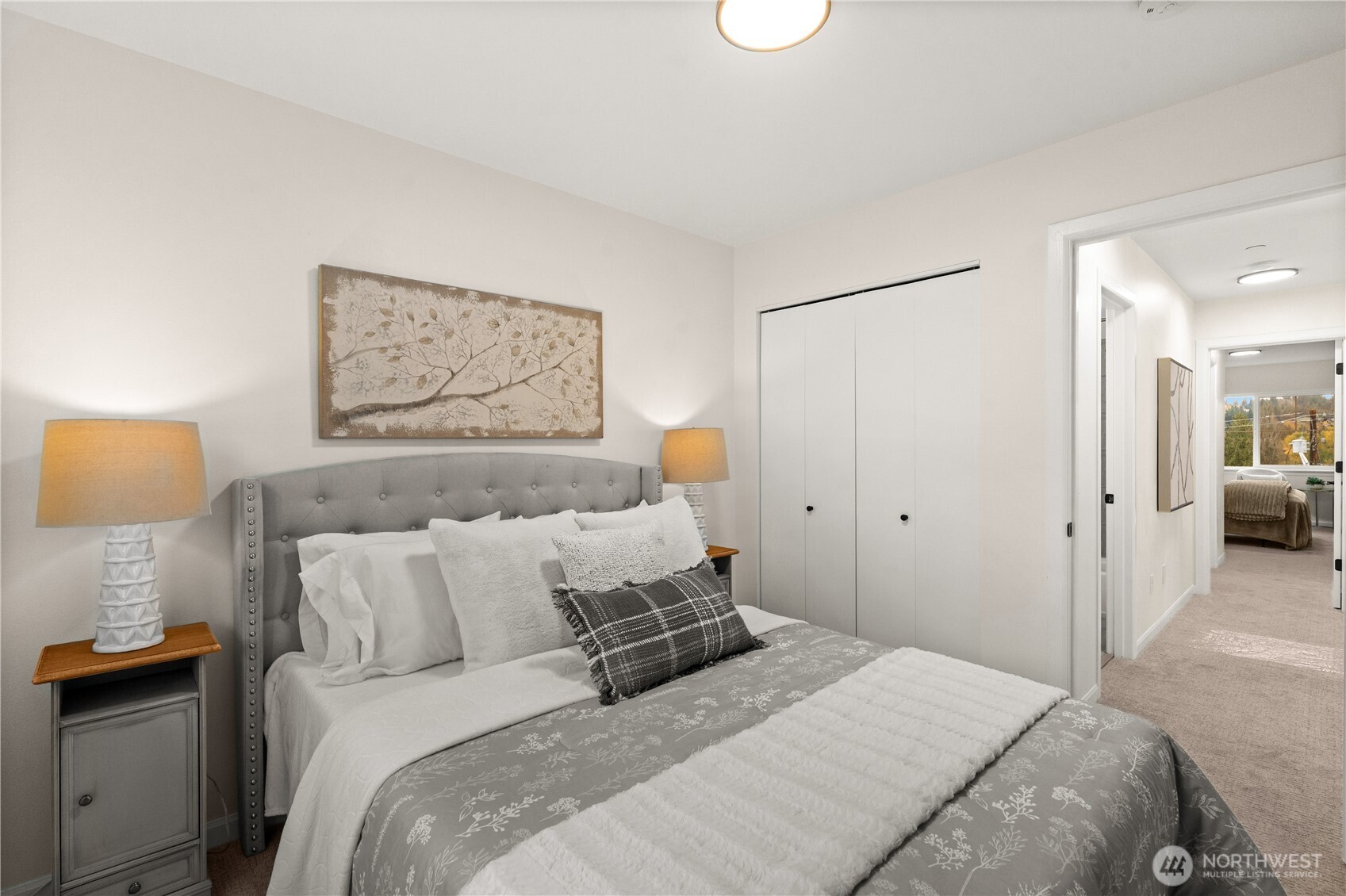 23202 Fitzgerald Road, Unit 2 Bothell, WA 98021 - Photo 16 of 20 a bedroom with a bed and a lamp on dresser