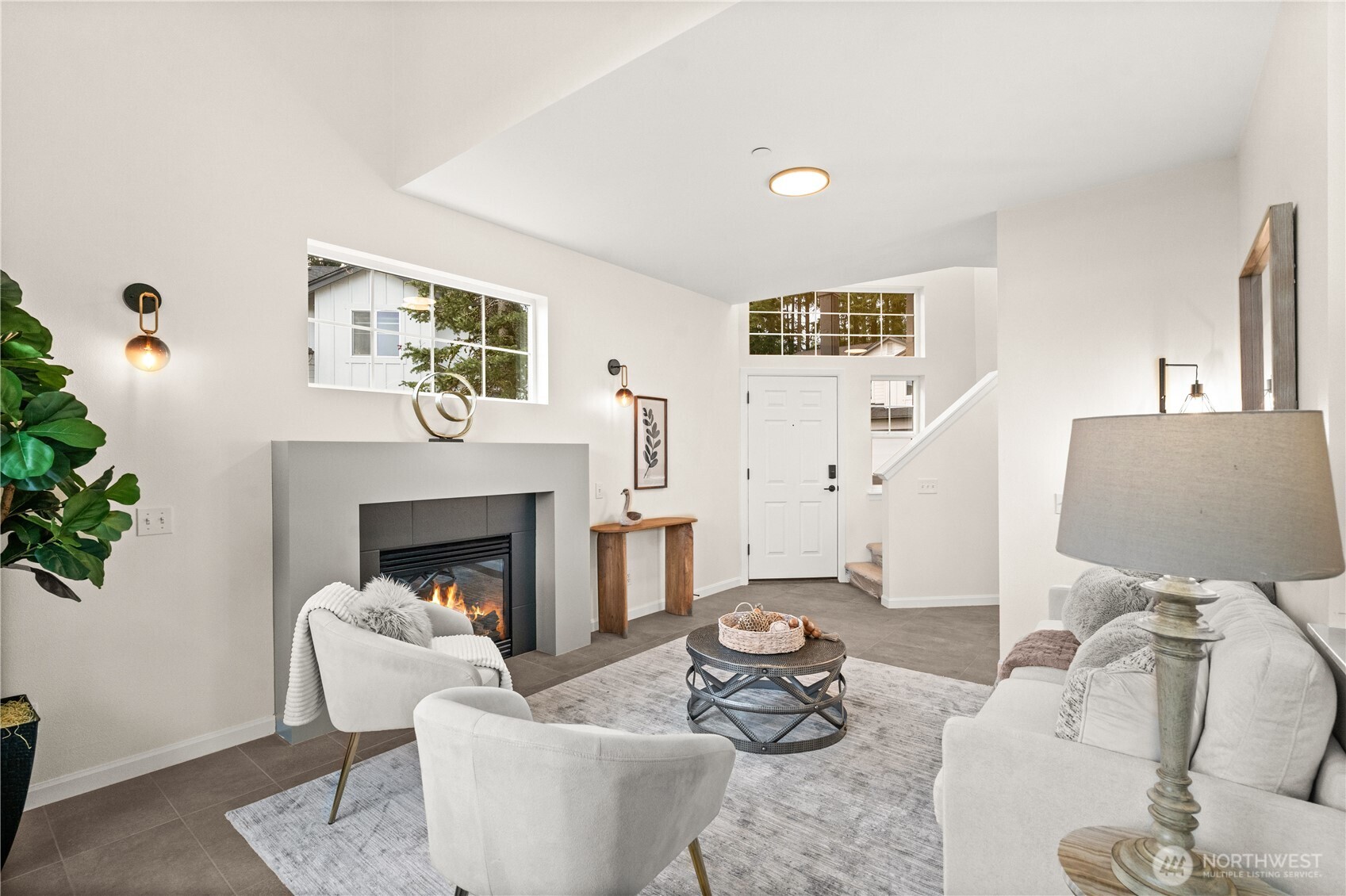 23202 Fitzgerald Road, Unit 2 Bothell, WA 98021 - Photo 3 of 20 a living room with furniture and a fireplace