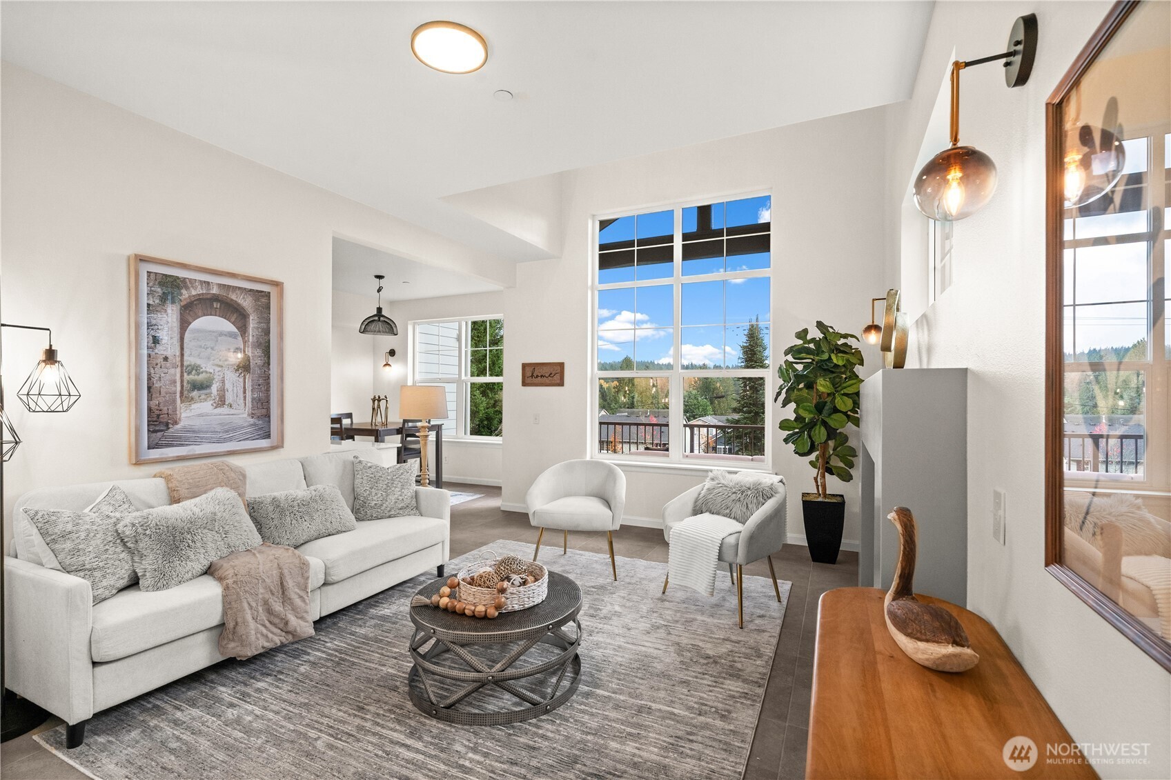 23202 Fitzgerald Road, Unit 2 Bothell, WA 98021 - Photo 4 of 20 a living room with furniture a large window and a table