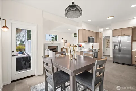 a dining room with furniture and window