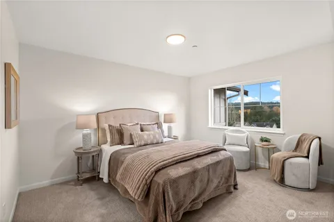 a bedroom with bed and window