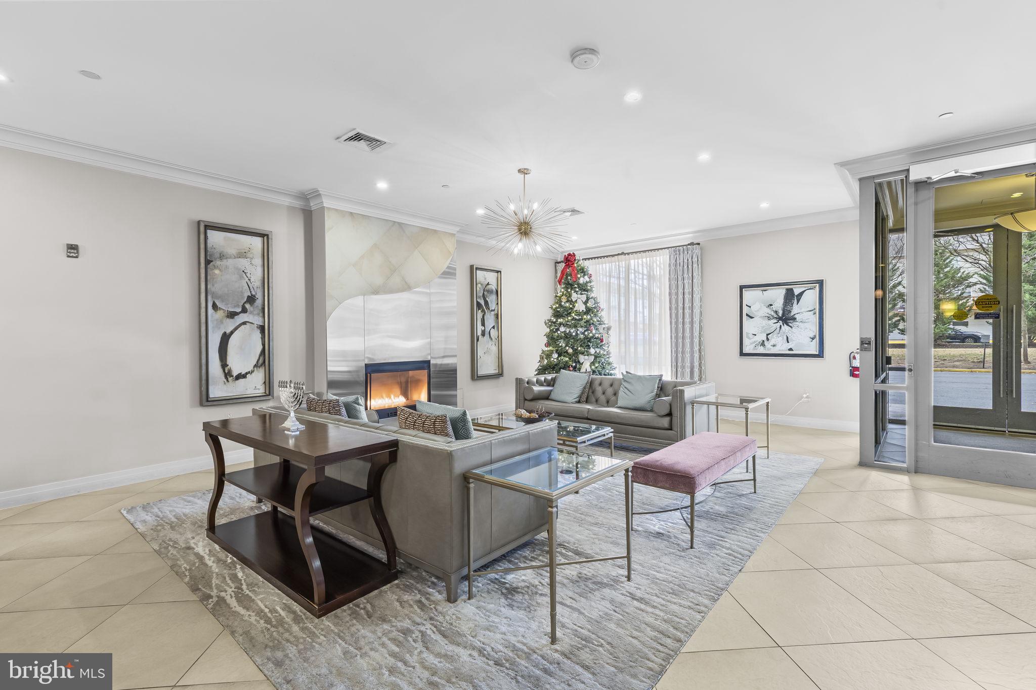 2451 Midtown Avenue, Unit 1413 Alexandria, VA 22303 - Photo 4 of 19 a living room with furniture and a fireplace