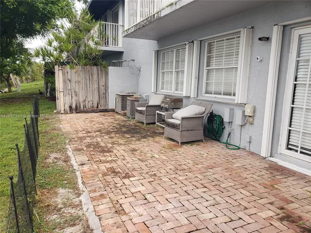 a backyard of a house with seating space