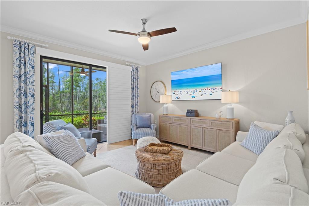 9715 Acqua Court, Unit 116 Naples, FL 34113 - Photo 1 of 43 a living room with furniture and a large window