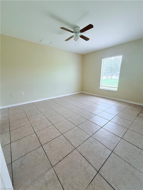 5212 30th Street Southwest Lehigh Acres, FL 33973 - Photo 11 of 15 a view of an empty room and a window