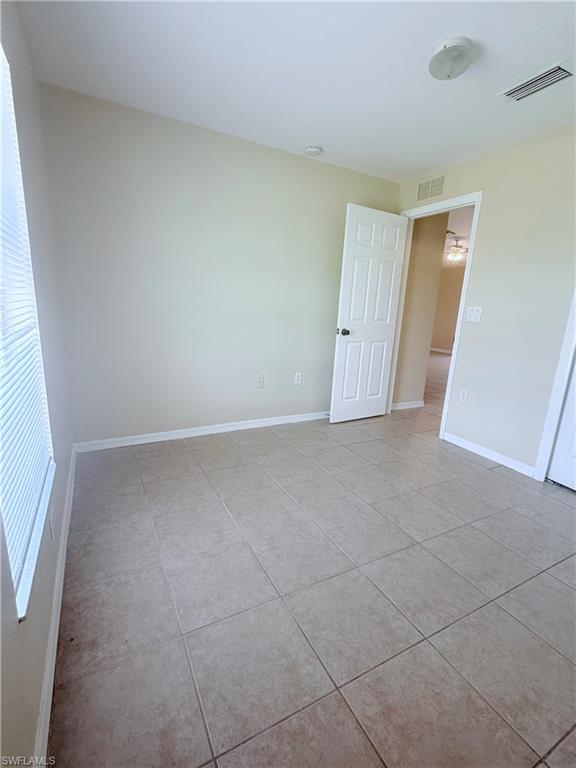 5212 30th Street Southwest Lehigh Acres, FL 33973 - Photo 15 of 15 an empty room with windows