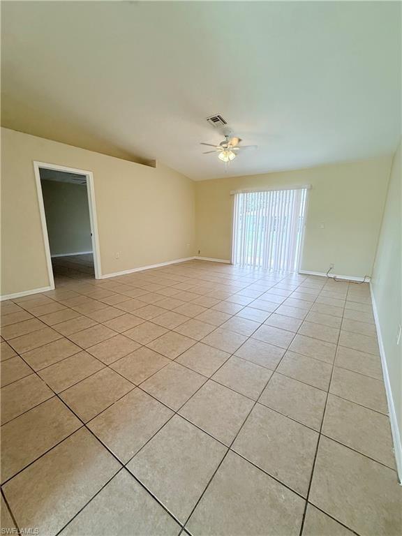 5212 30th Street Southwest Lehigh Acres, FL 33973 - Photo 4 of 15 a view of an empty room and a window
