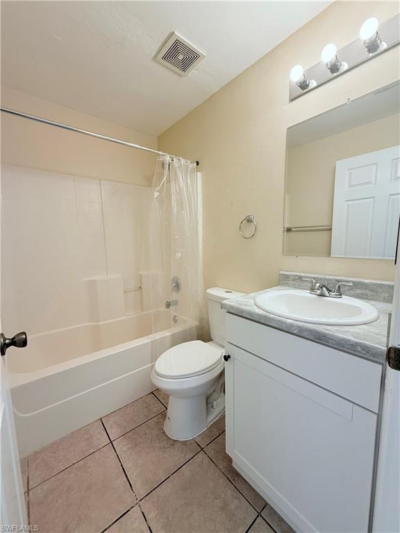 5212 30th Street Southwest Lehigh Acres, FL 33973 - Photo 7 of 15 a bathroom with a sink toilet and shower