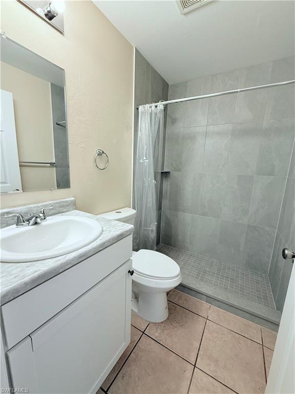 5212 30th Street Southwest Lehigh Acres, FL 33973 - Photo 8 of 15 a bathroom with a sink toilet and shower