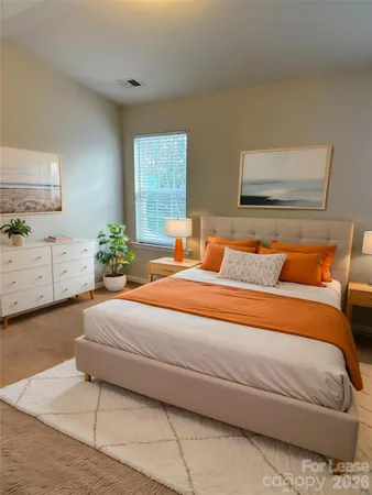 a bedroom with bed and window