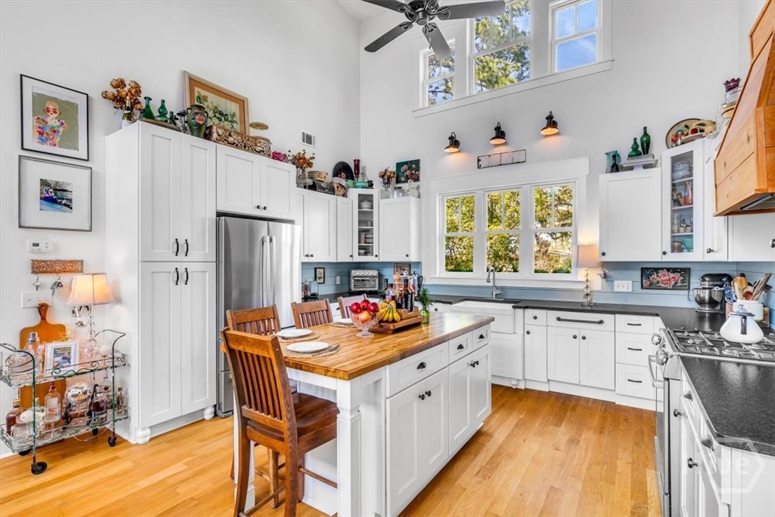 Kitchen: Bosch appliances, leathered granite, center island, and ample counter top space.