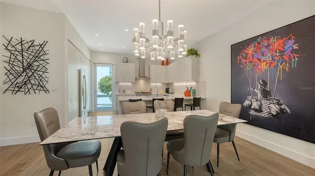 a kitchen with a sink a stove and cabinets