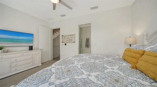 a living room with furniture and a view of bathroom
