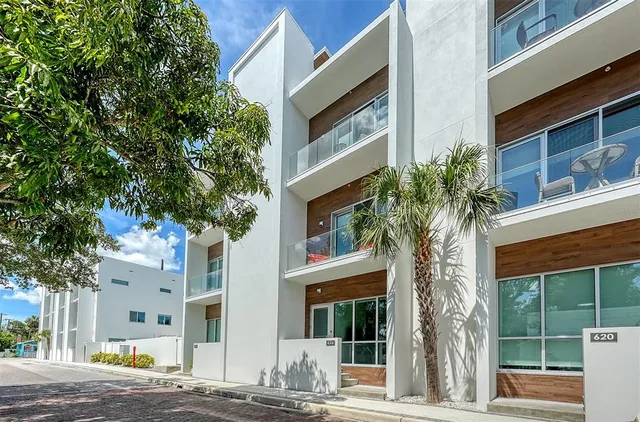 a dining room with furniture and chandelier