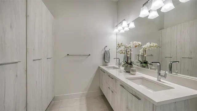 a view of a roof deck with table and chairs under an umbrella