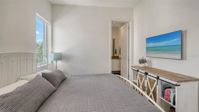 a living room with furniture a rug and white walls