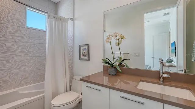 a view of a city with lush green forest