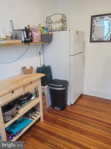 a view of a kitchen with appliances and cabinets