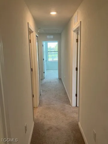 a view of a house with backyard and porch