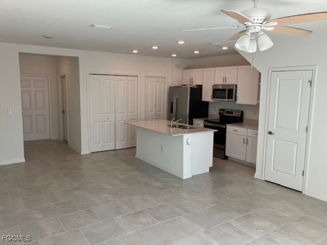 14309 Oviedo Place Fort Myers, FL 33905 - Photo 3 of 30 a view of a kitchen with electric appliances