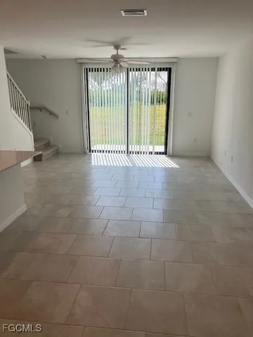 a view of an empty room with a iron stairs