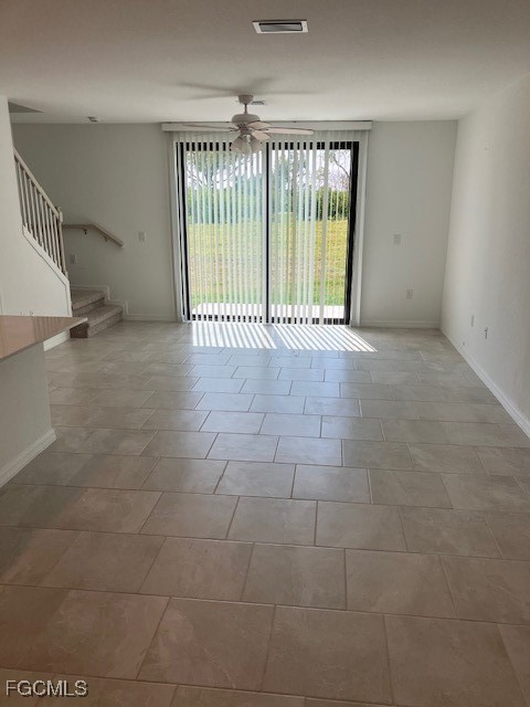 14309 Oviedo Place Fort Myers, FL 33905 - Photo 5 of 30 a view of an empty room with a iron stairs
