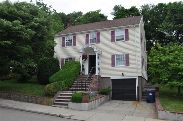 23 Clancy Road Boston, MA 02124 - Photo 1 of 11 a front view of a house with garden