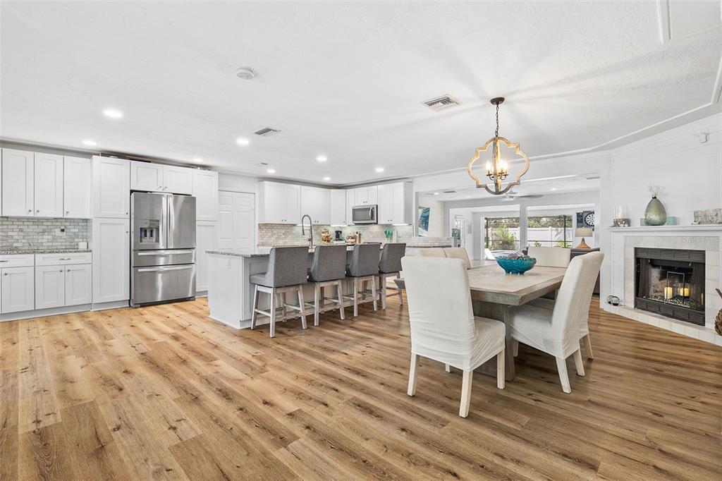 2215 Hibiscus Street Sarasota, FL 34239 - Photo 11 of 69 a open kitchen with a table and chairs in it