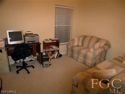 10683 Holly Road Bokeelia, FL 33922 - Photo 7 of 10 a view of a workspace with a window