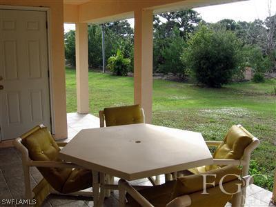 10683 Holly Road Bokeelia, FL 33922 - Photo 9 of 10 a view of an outdoor seating area