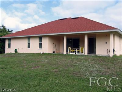 10683 Holly Road Bokeelia, FL 33922 - Photo 10 of 10 a front view of a house with garden