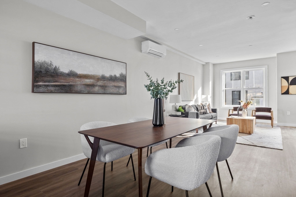 33 Copeland Street, Unit C Boston, MA 02119 - Photo 7 of 23 a view of a dining room with furniture and wooden floor