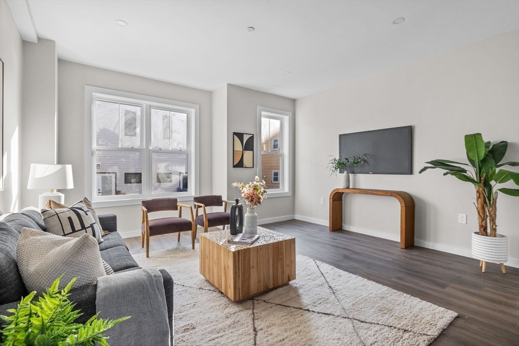 33 Copeland Street, Unit C Boston, MA 02119 - Photo 9 of 23 a living room with furniture and a large window