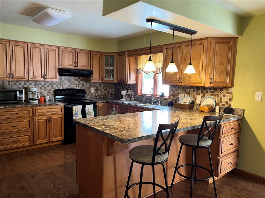 Beautifully updated modern kitchen with lots of countertops and cabinets