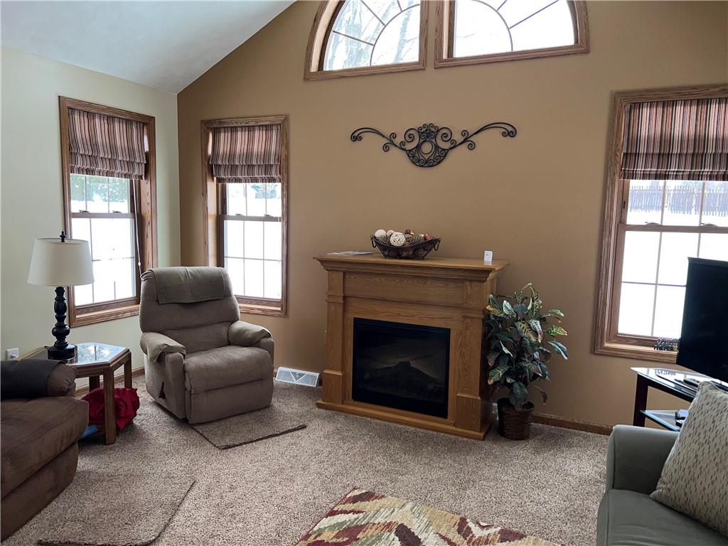 1027 Christy Road Hermitage, PA 16148 - Photo 10 of 25 beautiful family room with electric fireplace and arched windows allowing the sunlight to stream through. Family room leads to a deck