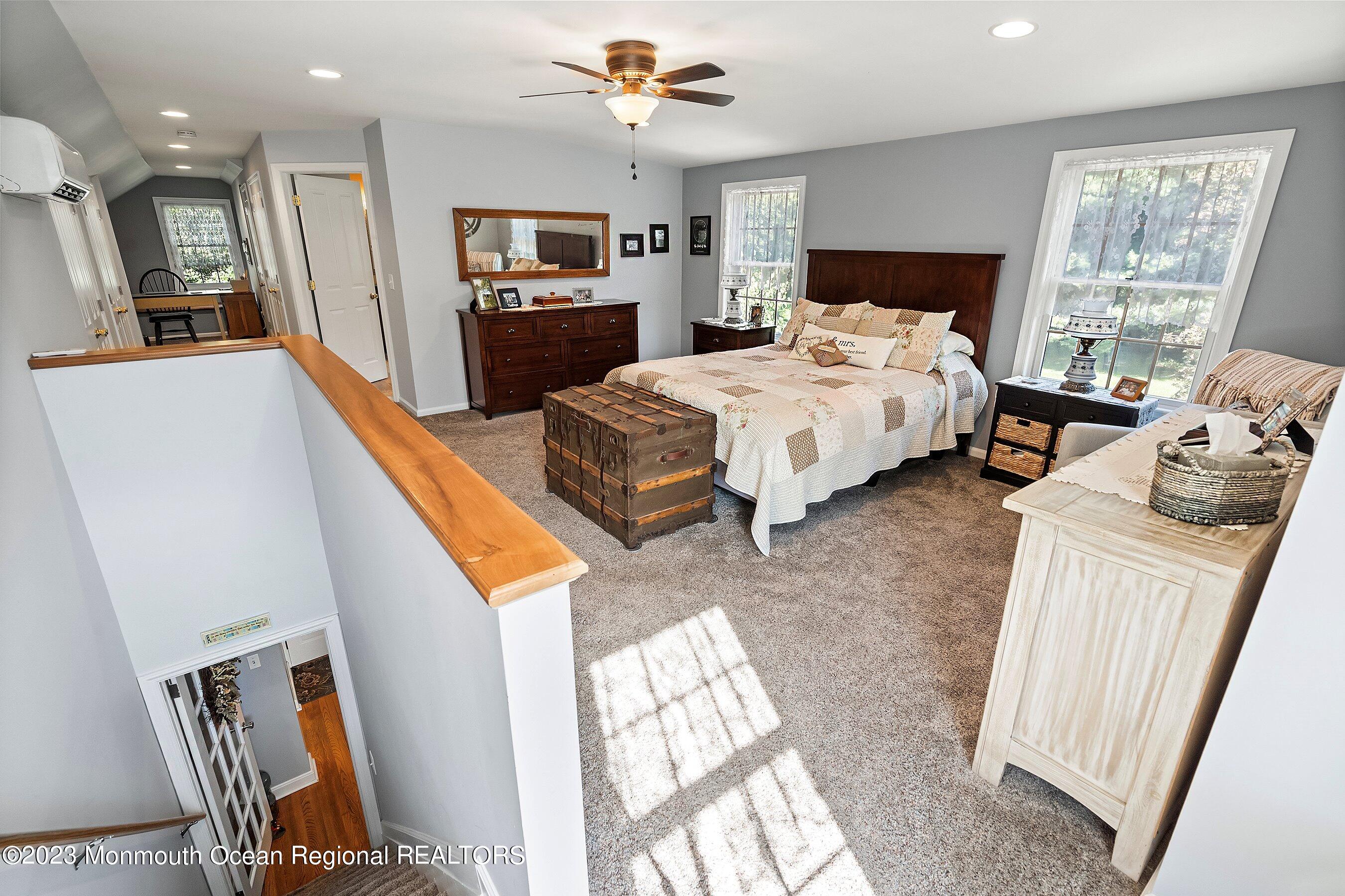 154 Adelphia Road Farmingdale, NJ 07727 - Photo 20 of 34 a bedroom with furniture and a flat screen tv